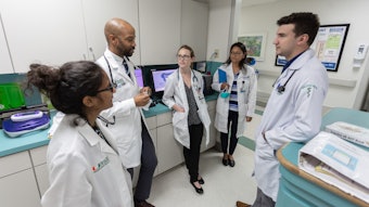 Group of pharmacists having a conversation in a medical setting.