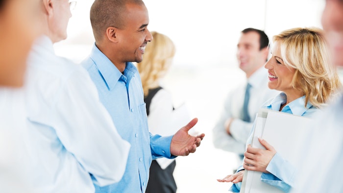 Group of business professionals networking
