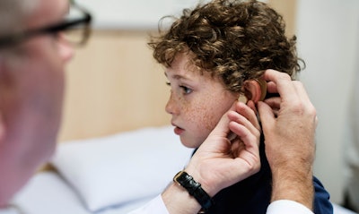 Child With Hearing Aid Base