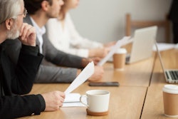 Image of focus group at a table.