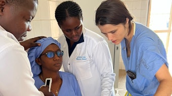 Dr. Lilly reviewing thyroid anatomy via point of care ultrasound with Rwandan medical students.