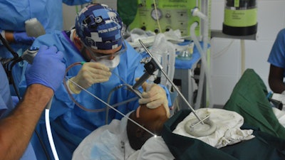 Dr. Bowers excising respiratory papillomas in a pediatric patient.