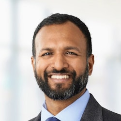 Head shot of Benji Mathews, MD, MBA, SFHM