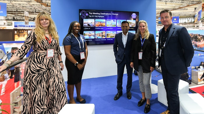 The Cvent team welcomes Tracy Halliwell, London Convention Bureau, and Rajesh Agrawal, deputy mayor of London for Business. Pictured, from left, are Halliwell; Felicia Asiedu, senior marketing manager, Europe, Cvent; Agrawal; Nicola Allen, director, hospitality cloud marketing, Europe, Cvent; and Graham Pope, vice president of international sales, Cvent.