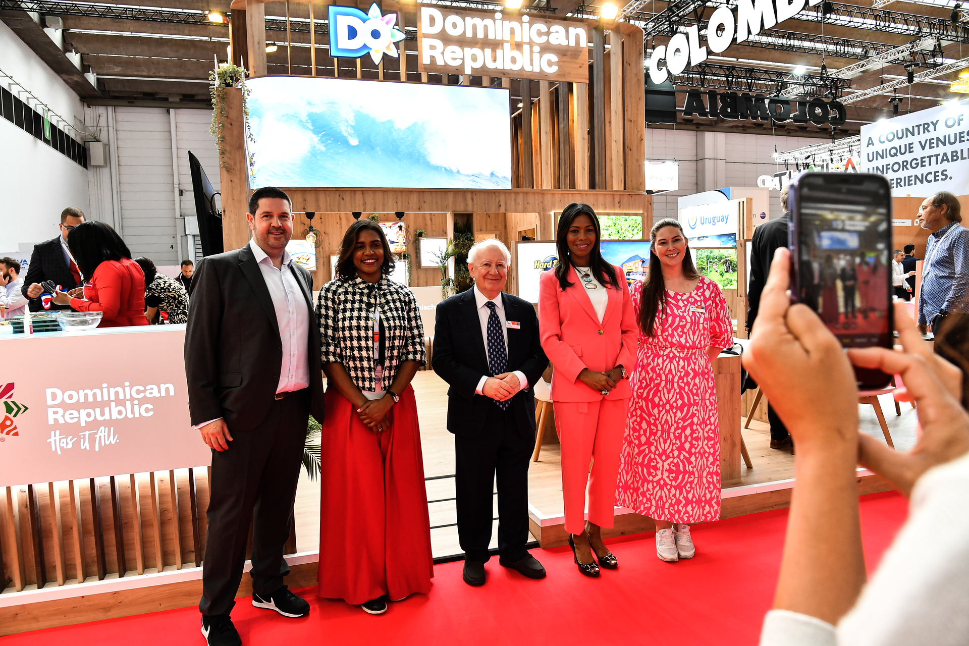 IMEX Group Chairman Ray Bloom and Dominican Republic and IMEX team members officially open the Dominican Republic stand for 2023.