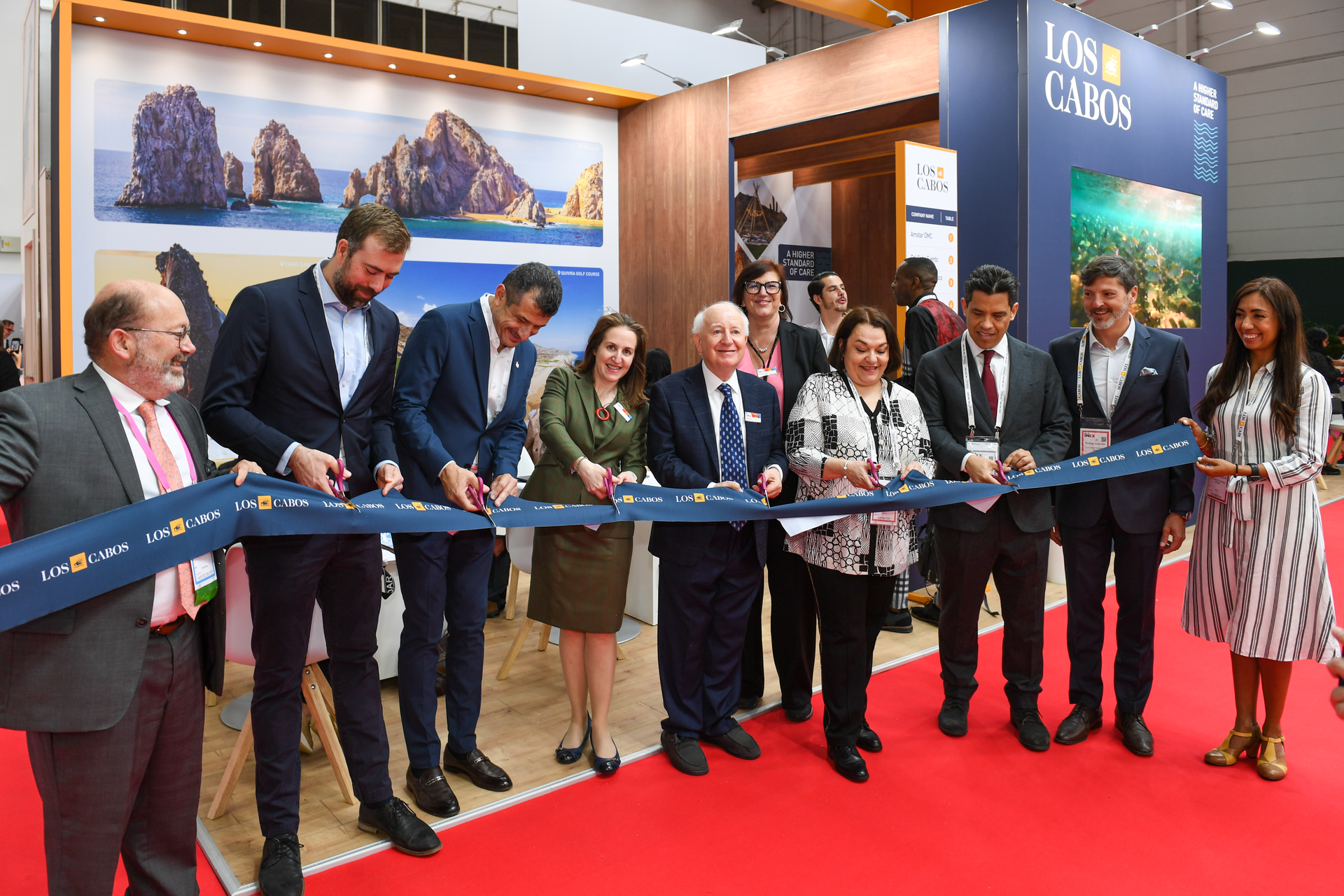 Los Cabos officially opened its stand at IMEX Frankfurt with a ribbon-cutting ceremony. Pictured: Ray Bloom, chairman, IMEX Group; Carina Bauer, CEO, IMEX Group; and Los Cabos and IMEX team members.