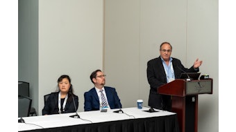 From left to right: Dr. Pham, Dr. Gold, and Dr. Stolovitzky (at podium).