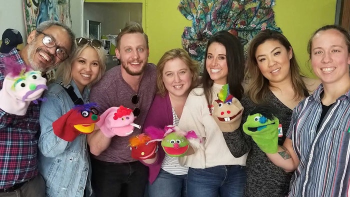 Mystery Trip plans custom, creative and spontaneous team-bonding events, such as a group puppet show.