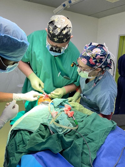 Team members Dr. Ryan Winters and Dr. Henya Sandhaus operating along with a surgical resident from Ujjain.
