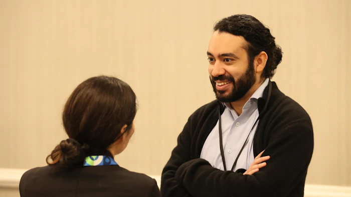 Two attendees talking to each other