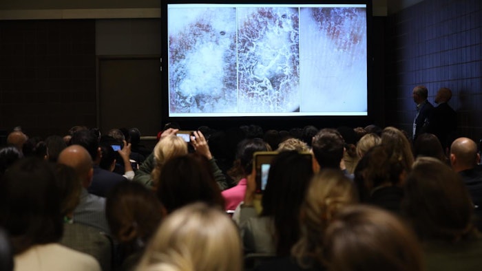 Audience looking at presentation slide