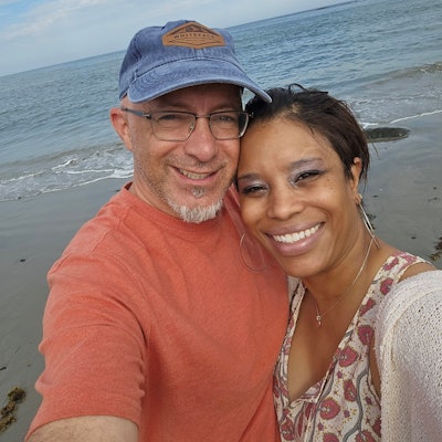 Angela M. Powell, MD, (right) with her husband Gregory Saufley.