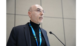 Robert Bissonnette delivers presentation at podium