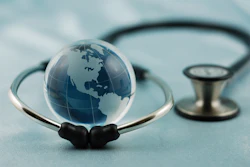 Stethoscope surrounding a graphic of a globe.
