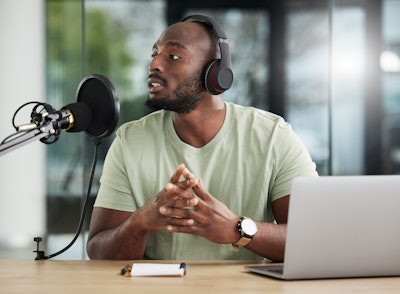 Man Talking Into Microphone
