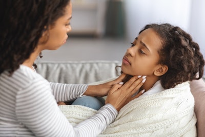 Mother And Child With Sore Throat