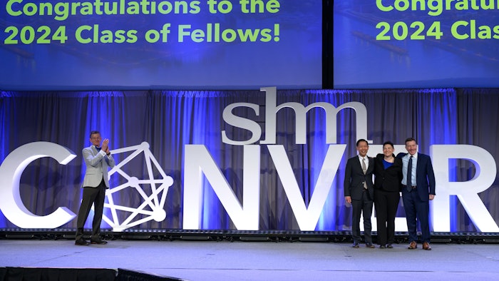 SHM CEO Eric Howell, MD, MHM, congratulates Jerome C. Siy, MD, MHA, MHM (left), Tara Lagu, MD, MPH, MHM, and Leonard Feldman, MD, FAAP, FACP, MHM.