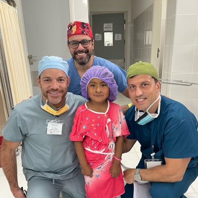 A four-year-old going back for a nasal hemangioma excision and cleft palate repair with craniofacial surgeon Fernando Almas Carvalho, MD (center), and anesthesiologists Roy Berenholtz, MD (left), and Daniel Torma, MD (right).