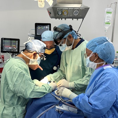 Otolaryngologists Vikas Mehta, MD (AAO-HNSF Coordinator for Research Quality), and Dilip Madnani, MD (right) operating during the trip.
