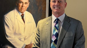 Dr. Backous poses next a portrait of his mentor, the late Bobby R. Alford, MD, former Baylor College of Medicine Chancellor and Distinguished Service Professor.
