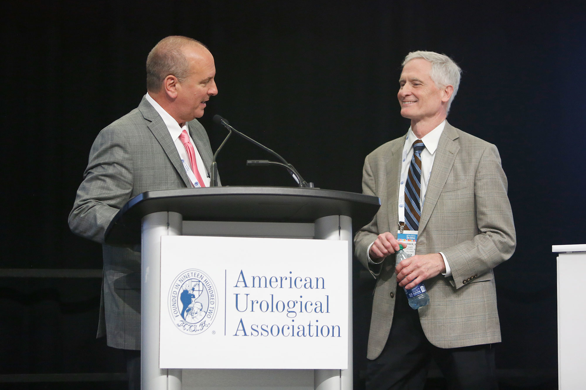 speakers at a podium