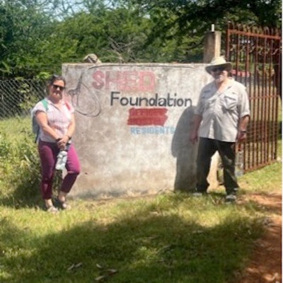 The author and his wife, Leigh Sassler, RN, at the entrance to the SHED Foundation compound in Shirati.