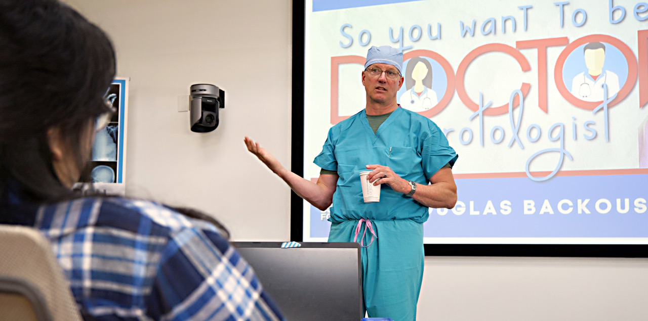 Douglas D. Backous, MD, speaks at a mentorship program at the Seattle Science Foundation in July 2024 to encourage underrepresented high school and college students to pursue medicine.