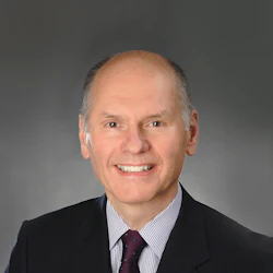 This is a professional headshot of Dr. Ken Tomecki, dermatologist.