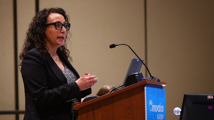 This is a photo of Eva Parker, MD, DTMH, FAAD speaking at AAD's Innovation Academy.