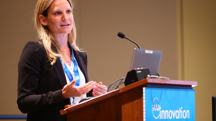 This is a photo of Elizabeth Jones, MD, FAAD speaking from a podium at AAD's Innovation Academy.