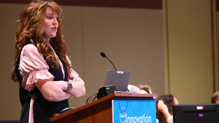 This photo is of Marta Van Beek, MD, MPH, FAAD addressing attendees from a podium at AAD's Innovation Academy.