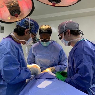 (Left to right) Dr. Chi, Dr. Wamkpah, and Kale McMillan, MD, perform a rhinoplasty and lip scar revision.