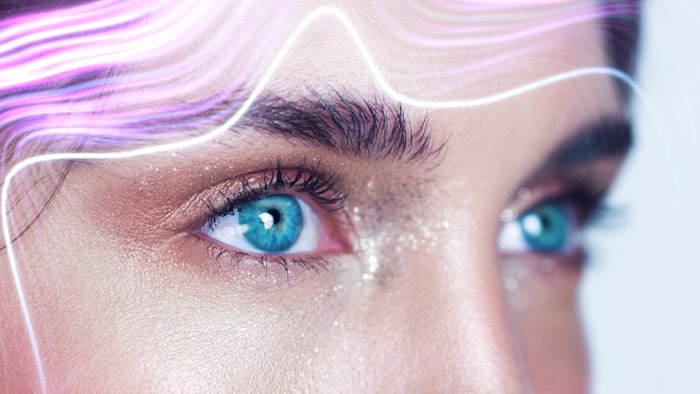 This is a futuristic look at cosmetic dermatology with purple sound waves going across a woman's forehead.