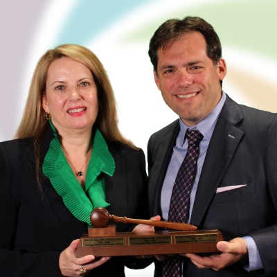 Dr. Chelius hands the Annual Meeting gavel over to Dr. Damask, in Miami Beach.