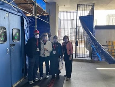 Dr. Shah (left) rounding during the COVID-19 pandemic to thank hospital staff for their efforts.