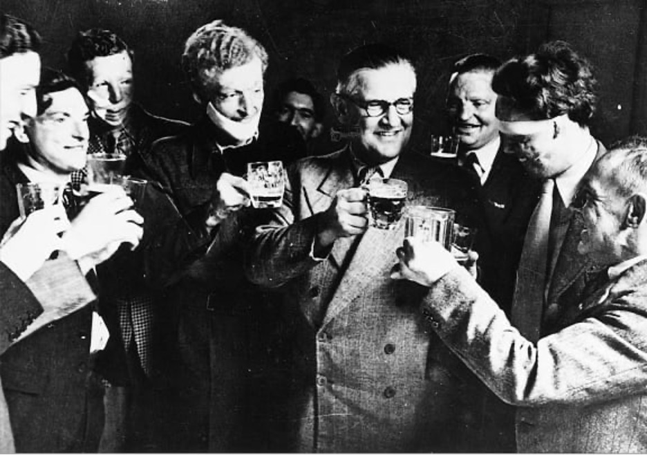 Figure 3. Archibald McIndoe, CBE FRCS, celebrating with his patients.10