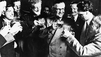 Figure 3. Archibald McIndoe, CBE FRCS, celebrating with his patients.10