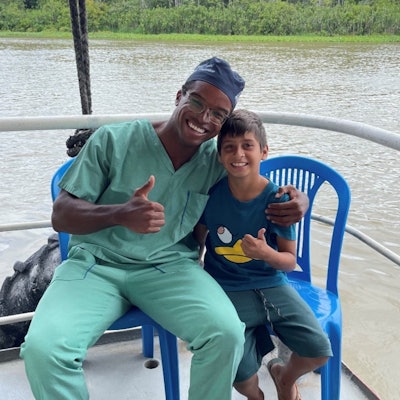 A happy patient after his tongue-tie surgery on the floating hospital ship.