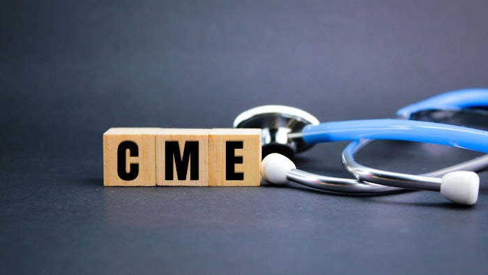 CME on wooden blocks next to a stethoscope.