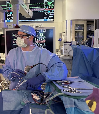 The author, Tyler Merrill, MD, performs surgery with adaptations to accommodate his left-handedness.