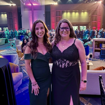 Meghan (left) and colleague, Beth Burchill, all dressed up for an event industry networking reception.
