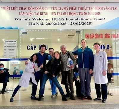 The author, companions, and local surgeons during their most recent trip to Vietnam.