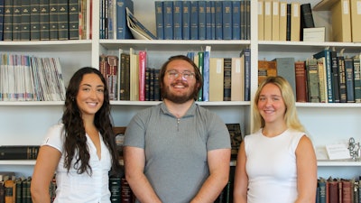 (Left to right): Emma, Ethan, and Piper in front of the Bulletin archives at the The John Q. Adams Center for the History of Otolaryngology-Head and Neck Surgery in Alexandria, Virginia.