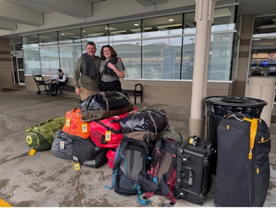 The dynamic father-daughter duo, Dr. Zender and Reiley Zender, RN, arrive at the airport, ready to roll with their carefully packed surgical supplies.