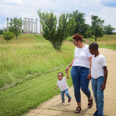 Teona and her children enjoy a walk in nature.