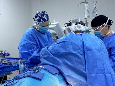 Partners For Belize medical team during a thyroid goiter removal, including surgeon Dr. Marathe, Abigail Homan, and Colleen Smith, MA.