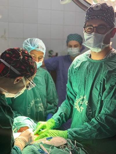 A multidisciplinary team at Kibagabaga Hospital performs a thyroidectomy, highlighting the adaptability required to deliver specialized endocrine surgical care in resource-limited environments.