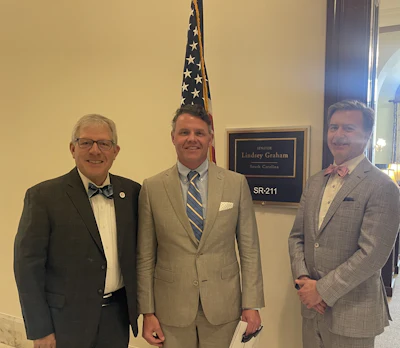 Left to right: Dr. Brown with Dr. Scarlett and Dole P. Baker, Jr., MD, standing outside the office of Senator Lindsey Graham, representing their home state of South Carolina.