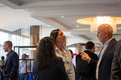 Attendees enjoying the time to network and connect with peers and exhibitors during the Friday evening Networking Reception.