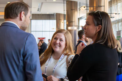 Attendees enjoying the time to network and connect with peers and exhibitors during the Friday evening Networking Reception.